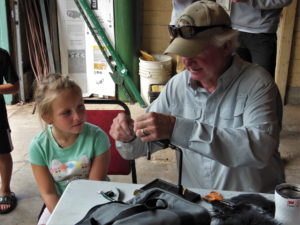A pupil eager to learn fly tying